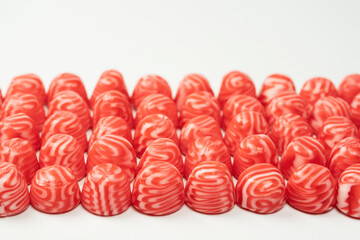 Red round tasty gummy candies islolated on a white background.