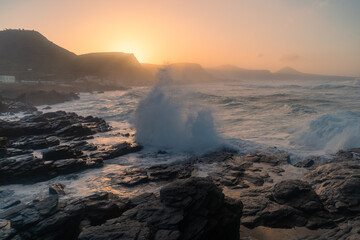Fototapeta premium Seascape with big waves in Quintanilla at sunset. Arucas. Gran Canaria 