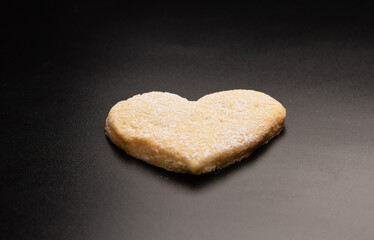 Shortbread in the shape of a heart isolated on white background.