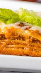Italian bolognese lasagna with lettuce 