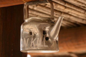 Aluminium kettle bitten by lions in the Kgalagadi