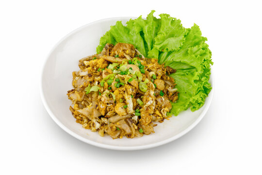 Stir fried Chicken Noodles and egg, White plate top view isolated on white background.