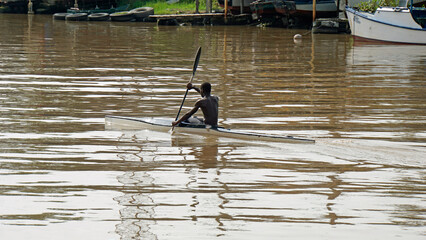 local riding a canoe on matanzas river