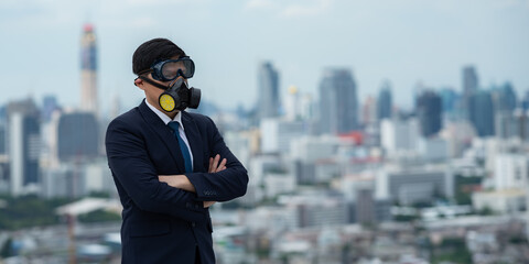 portrait of businessman wearing gas pollution protection face mask and suit, concept of danger toxic safety for human and chemical environment problem man about hazard business