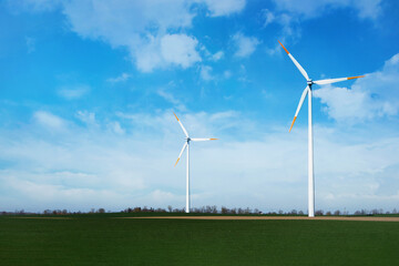 Fototapeta premium Windmills against the sky, a beautiful place nature and fields