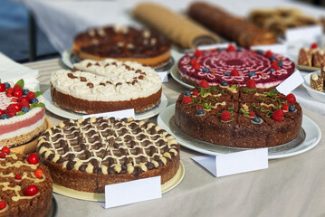 A stand with cakes offered for sale at the Náplavka farmers market in Prague.