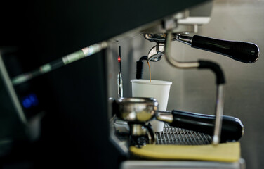  making coffee with machine in cafe.