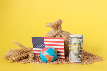 Grain of wheat beside, USA flag, with dollars and globe. Harvest concept. Export Import. Food crisis during the war, sanctions