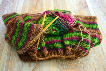 multicolored, warm knitted fabric sweater, knitting texture, fuzzy background