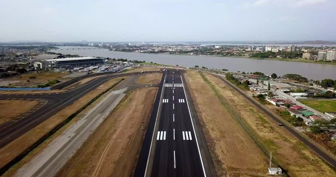 Moving Aerial Footage over airport runway maintenance 4K