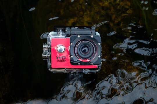 Action camera in the water in a protected waterproof case.