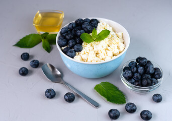 Dessert for breakfast of cottage cheese, fresh berries and honey. Close-up.