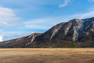 Fototapeta premium Landscape, road trip scenes in Yukon Territory, during fall, autumn. Canadian travel, tourism. 