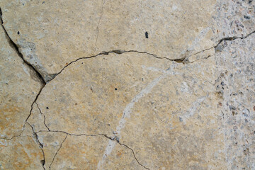 Cracked concrete slab. Wall made of cement with crack. House foundation repair. Texture surface or...