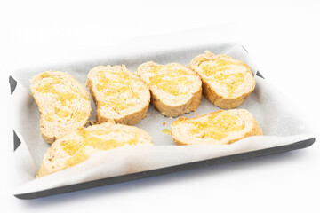 Baked bread with olive oil on the baking pan