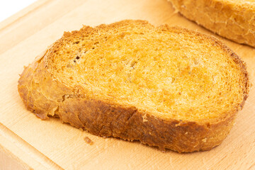 Baked bread with olive oil on the baking pan