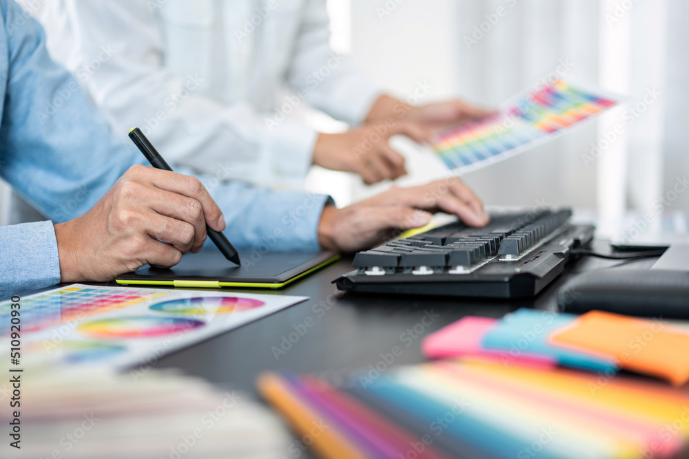 Aufkleber Team graphic designer working on document of color chart to brainstorming about new project together