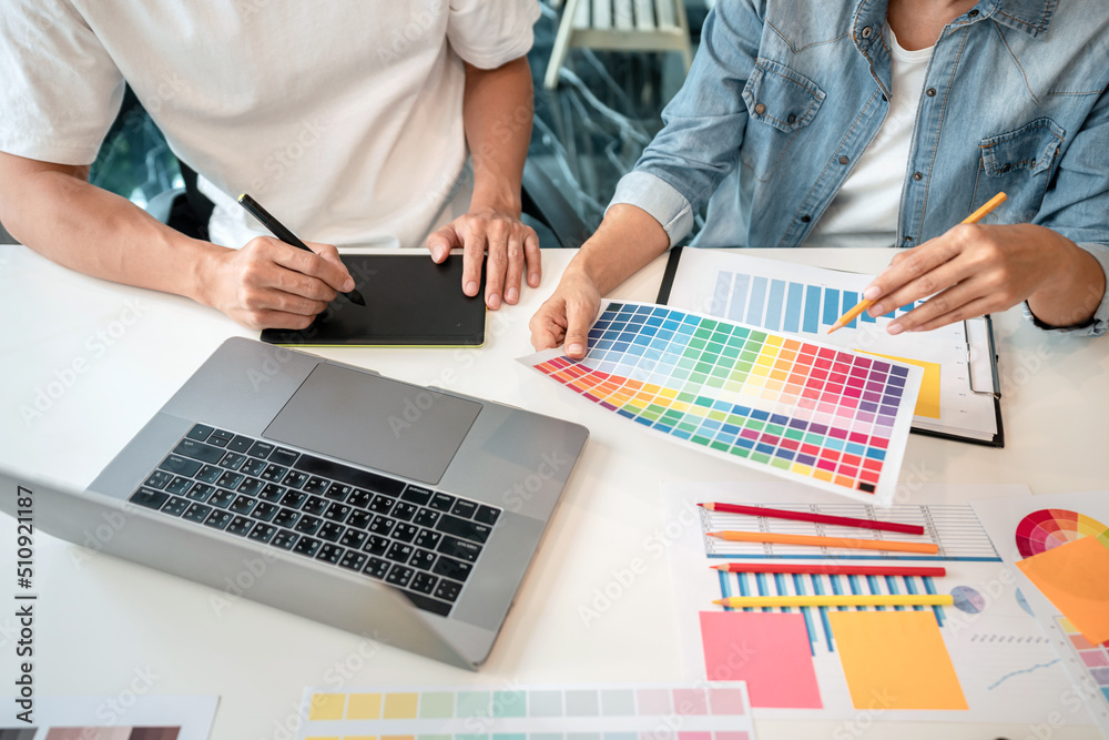 Aufkleber Team of creative graphic designer working on color swatch samples chart for selection coloring in inspiration to create new collection at workplace