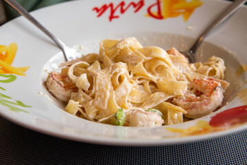 Pasta carbonara in a white plate. Traditional Italian cuisine.