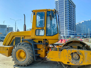 construction equipment yellow. excavator for construction, sand transfer. large wheels on construction equipment, yellow color of the excavator