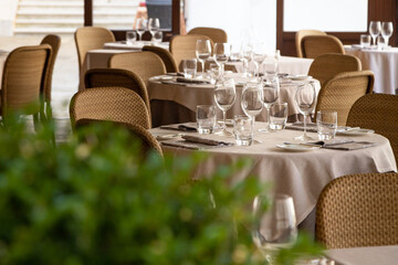 Served tables with glasses in the restaurant