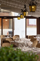 Served tables with glasses in the restaurant