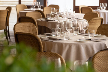 Served tables with glasses in the restaurant