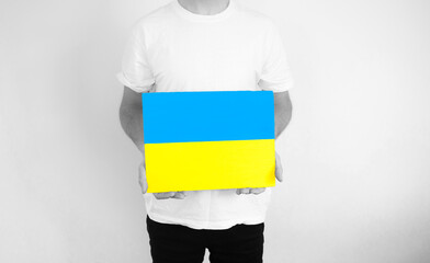 The guy with the plate in the form of a yellow and blue flag of Ukraine.