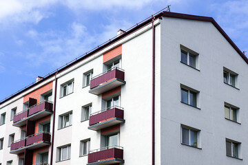 fragment of the facade of a renovated and thermally insulated multi-storey apartment house