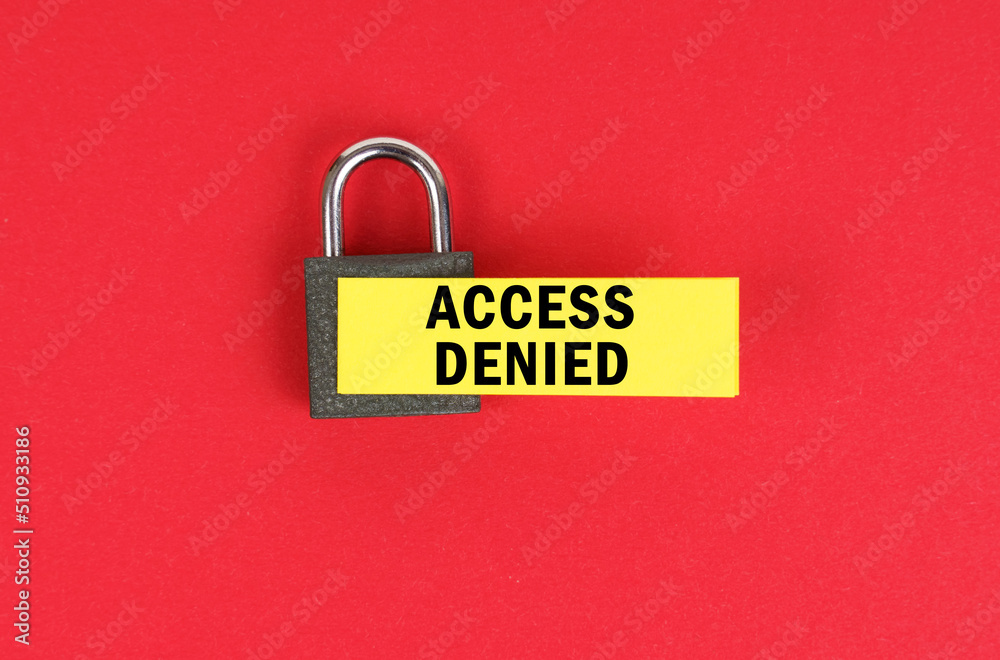 Poster on the red surface there is a lock with a sticker with the inscription - access denied