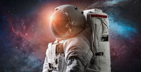 Astronaut in space. Galaxy and nebula space wallpaper. Spaceman sci-fi background. Elements of this...