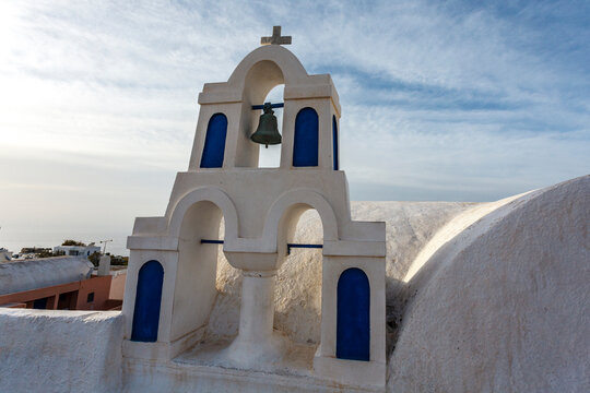 White Greek Orthodox church with bell tower, Oia, Santorini, Cyclades, Greece, Europe