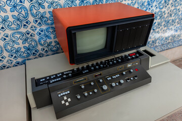 Retro technology computer with a monitor on the background azulejo tiles. Retro Fashion Wallpaper. Technology and Science