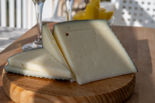 Spanish hard manchego, cow, sheep and goat cheese served outdoor in morning sunlights
