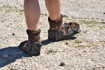Unusual shoes on the feet of a man.
