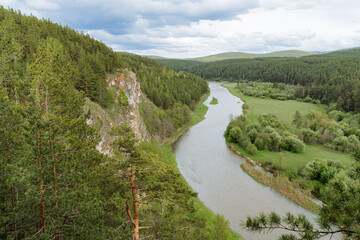 Fototapeta na wymiar The mountain river flows in Bashkiria, the nature of Russia is the Southern Urals, the beautiful landscape, the Chelyabinsk region, the Rock on the river.