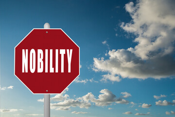 Red stop sign with the word Nobility on a blue sky background.