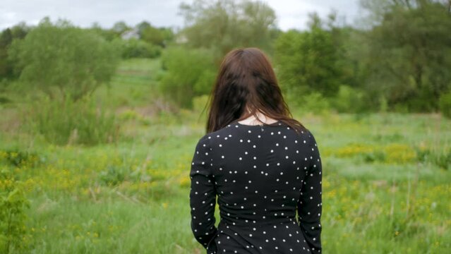 Beautiful seductive caucasian girl invites viewer to join her and walks away into the distance. Attractive white woman in black dress calls you to follow her and slowly strolls away. Following women

