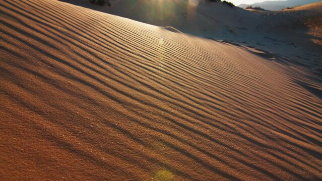 Sandy dunes near the town of Joaquina at sunset on the island of Santa Catarina in Brazil