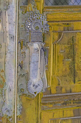 Old door with elaborate antique handle. - 510947512