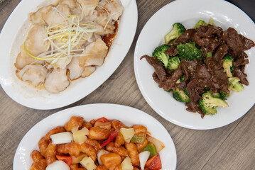 Overhead view of temping choices of meals with the beef and broccoli featured, for a great Chinese food meal