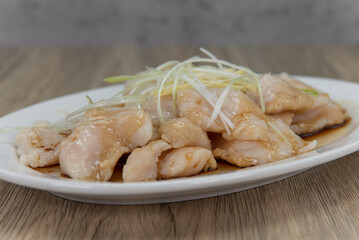 Steamed fish fillets in ginger sauce and piled high on the plate for a great Chinese food meal