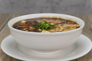 Spicy and generous bowl of hot and sour soup for a hearty Chinese food meal