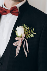 groom with flowers