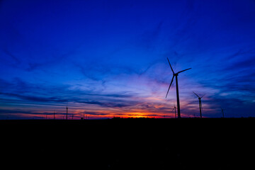 Sunset of A windmill farm somewhere in Indiana