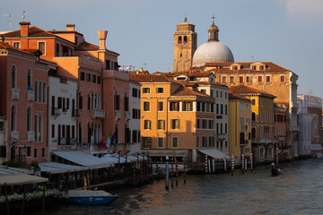 Fototapeta na wymiar Thinning late afternoon boat traffic near Ponte degli Scalzi in Venice, Italy on May the 13th, 2022