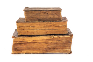 stack of three vintage shabby books on a white background.