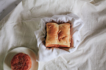 Homemade Fresh-baked homemade Hokkaido milk bread for Breakfast. Cooking at home. Selective focus. Bakery Concept Picture. Copy Space for Text