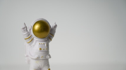 Astronaut figure raising finger at the moon, background, game, 3d 