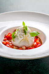 salad with buratta cheese and strawberries with basil macro close up vertical